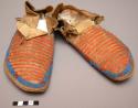 Pair of Sioux moccasins. Hard soles w/ soft uppers. Long triangular tongue