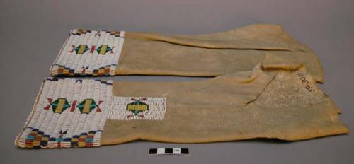 Pair of woman's leggings of deerskin, beaded bottoms