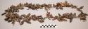 Medicine Man's necklace of hoof-pendants, brass trade beads, talons, quartz poin