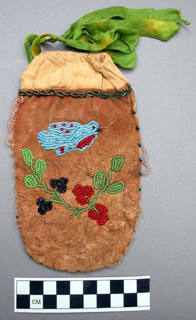 Skin pouch with bead decoration; green ribbon on handle