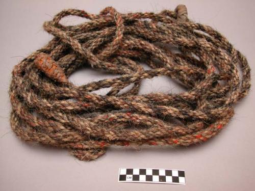 Rope. Braided leather loop through which horsehair rope passes.