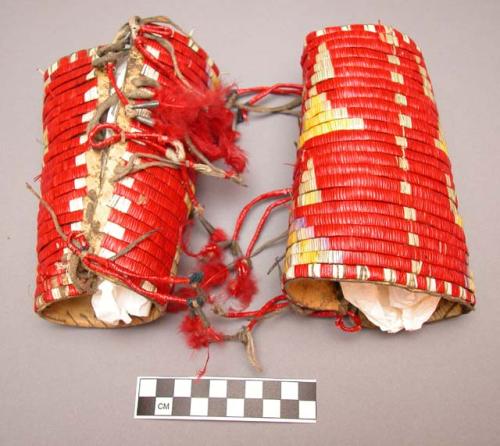 Pair of red porcupine quilled cuffs--feather decoration