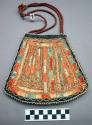 Quilled bag.Trapezoidally shaped hide, partially lined w/cloth, trimmed w/ribbon