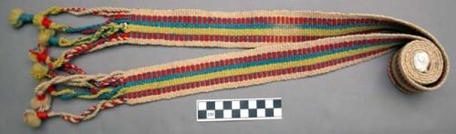 Woven wool belt, red, blue, and green stripes on white. 5 x 126 cm., minus bel