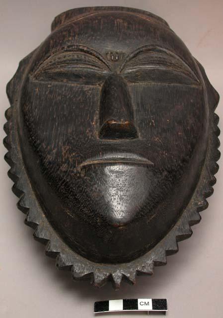 Baule bearded head, wood with black paint, 29 cm h. x 19 cm w.