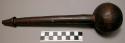 Wooden pounder, punched indentations on the head of tool, 11 in. length