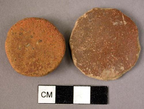 2 small pottery discs - red ware