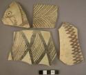 Ceramic rim and body sherds, fine thin ware, buff with black painted design
