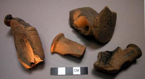 Earthenware fragments of devil trumpets (2 probably of male sex)