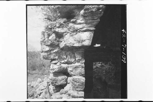 Wall masonry, medial moulding, spring, and vault face on west wall