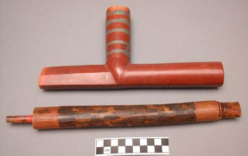 Catlinite pipe with wooden mouthpiece and stem.