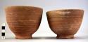 Two bowls of hard red ware, wet-smoothed and wheel-scored