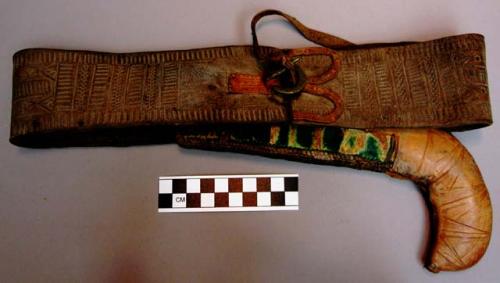 Knife sheath/ belt, stamped leather, brass buckle, green (oxidation?) on sheath