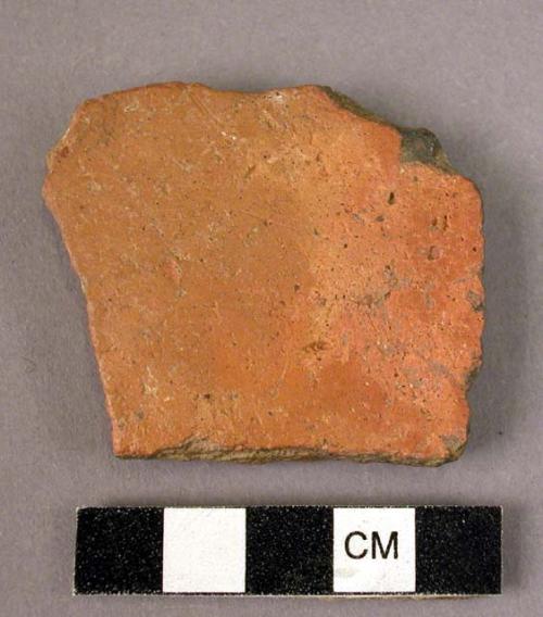 Potsherd - shiny orange-red outside surface; dull dark red inside surface