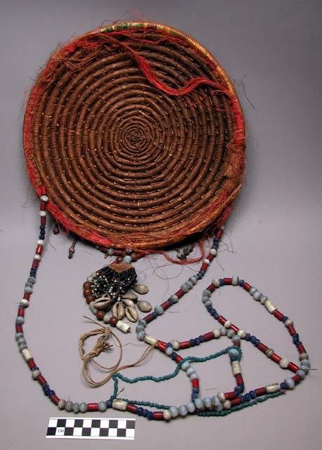 One coil built basket with elaborate beading for hanging