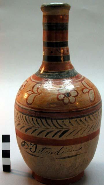 High-necked pottery jar- buff with floral design in orange and black