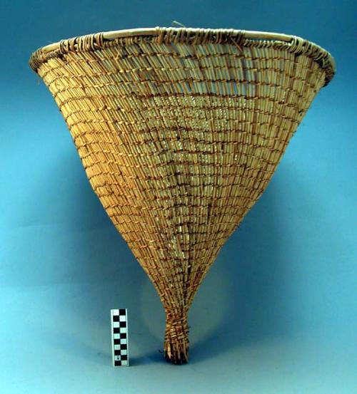 Small conical carrying basket of twined willow, for picking up pine nuts