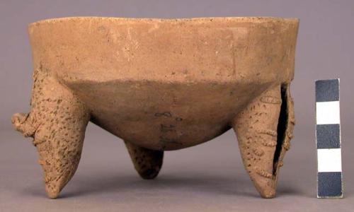 Pottery dish, tripod, legs hollow and carved