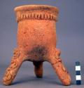 Ceramic, complete tripod jar, applied and incised decoration, coarse