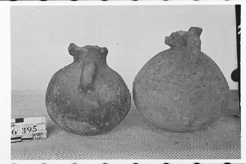 Two Small Pottery Jars with Animal Faces on Necks of Vessels