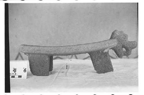 Tripod metate, tiger head at one end