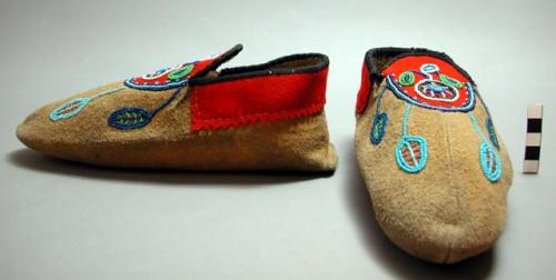 Mooseskin slipper moccasins. Seam runs down over toe and ends below ball of toe.