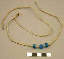 Necklace, 3 blue glass beads on leather string