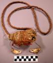 Shaman's bundle? Cedar bark cord is used to bind rags, crab & bird claws, down