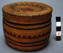 Small finely woven basket with cover.