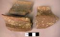 Ceramic rim sherds, brown slip, impressed geometric designs