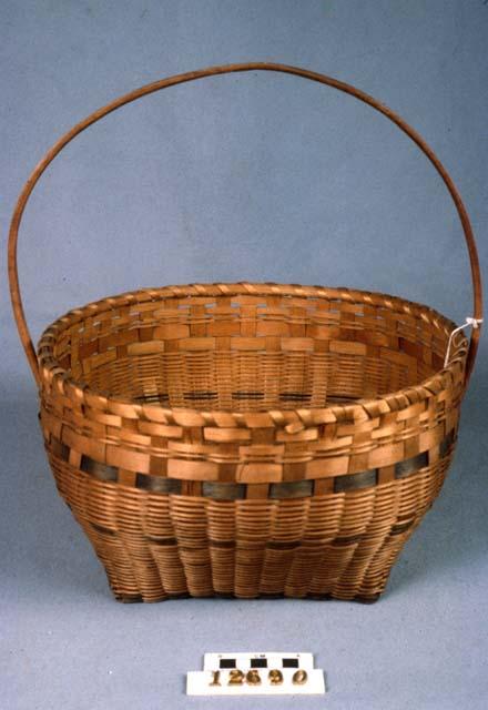 Medium sized basket--one wooden handle, four blue bands