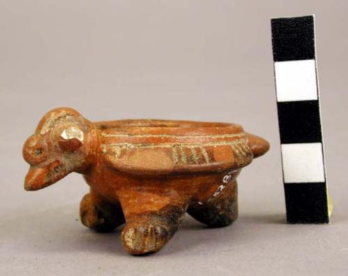 Bird effigy vessel found with slate mirror back