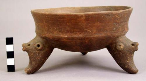 Tripod bowl with effigy face rattle legs