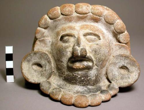 Pottery head from urn