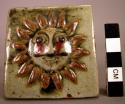 Ceramic glazed tile with sun face