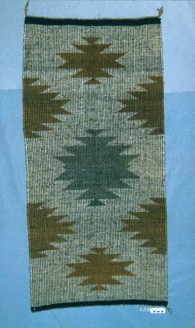 Coal Mine Mesa raised outline rug, center diamond-butterfly figure