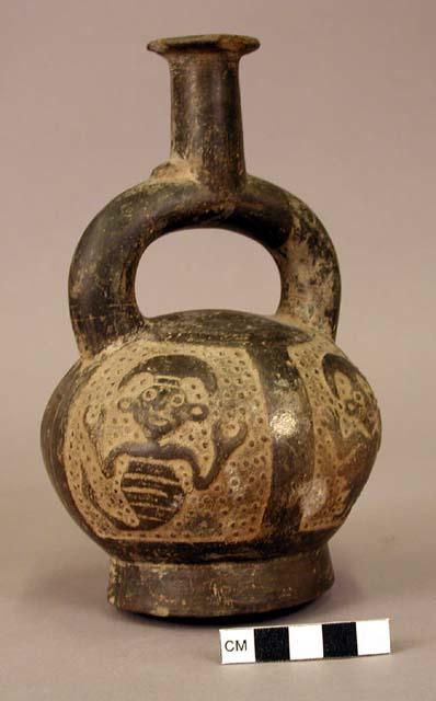 Ceramic bottle,stirrup spout, incised zoomorphic design, flat bottom, chipped ri