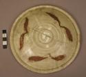 Grey ware cover for urn - green glaze design of conventional leaves; 2 concentric ridges in center