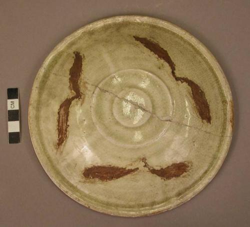 Grey ware cover for urn - green glaze design of conventional leaves; 2 concentric ridges in center
