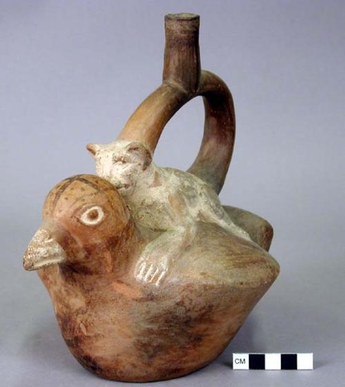 Stirrup spout bottle. Feline on back of condor