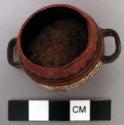 Miniature polychrome vessel, with two handles;  5 cm. d. incl. handles. 2 cm. h.