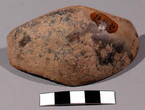 Small piece of gourd (tan) - used for smoothing off earthen kettles before firin