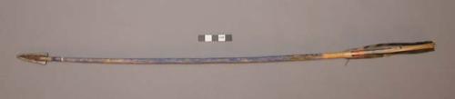 2 unidentified arrows w/ metal points held on w/ sinew. Shaft painted blue, and