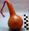 Small gourd rattle used only in individual singing and by men
