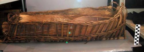 Twined palm-frond carrying basket