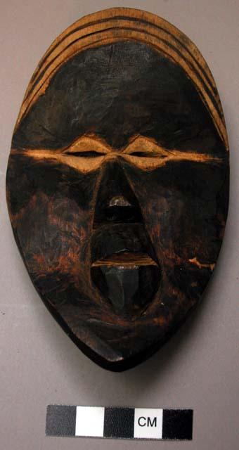 Small wooden face mask.