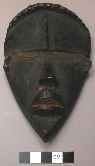 Small wooden face mask.