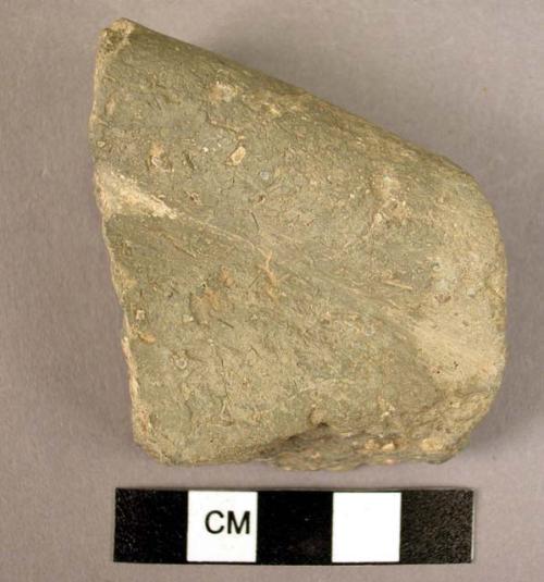 Ceramic rim sherd, thick walled, undecorated grey ware, incised below rim