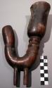 Pipe; carved wood pipe bowl; curved; 2 pegs at bottom; cracked