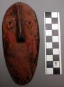 Bwami society maskette, kindi grade, with no mouth, wood, 5.5 in. h.